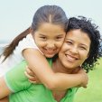 mom and daugther smiling